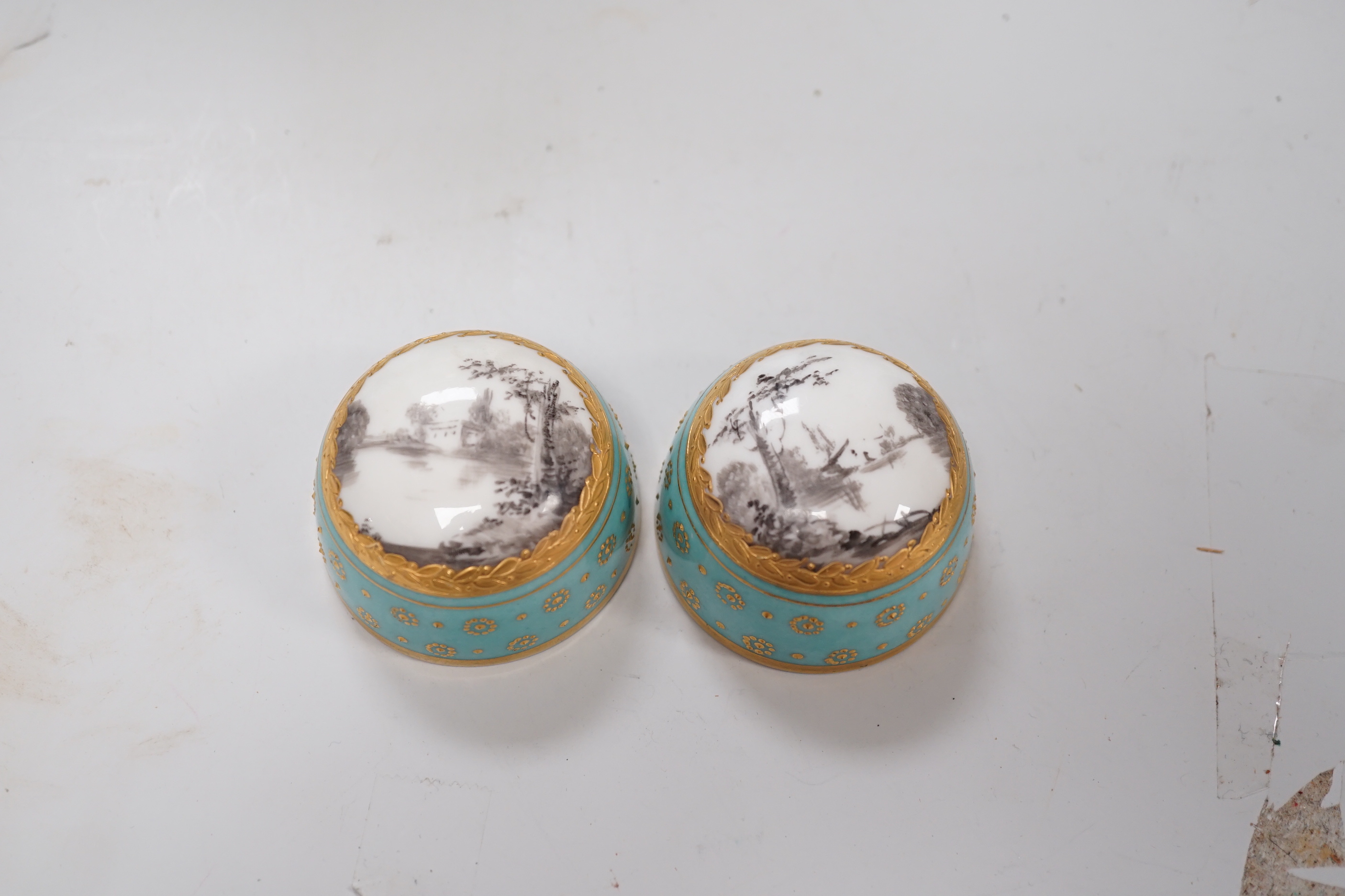 A pair of late 19th century Sevres style turquoise ground vases and covers, 24cm